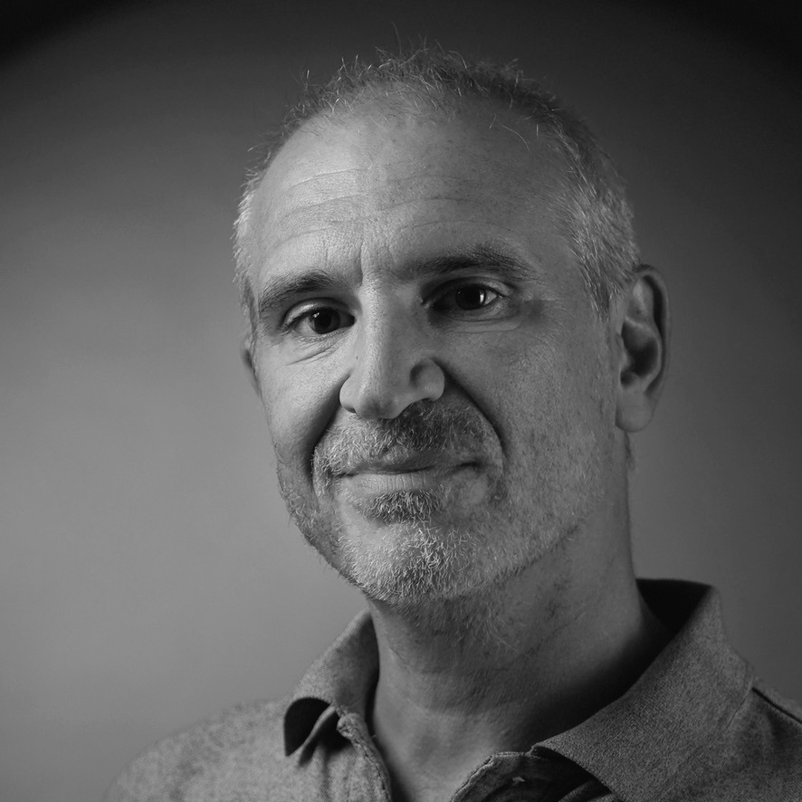 Black-and-white portrait of Olivier, a French photographer in London