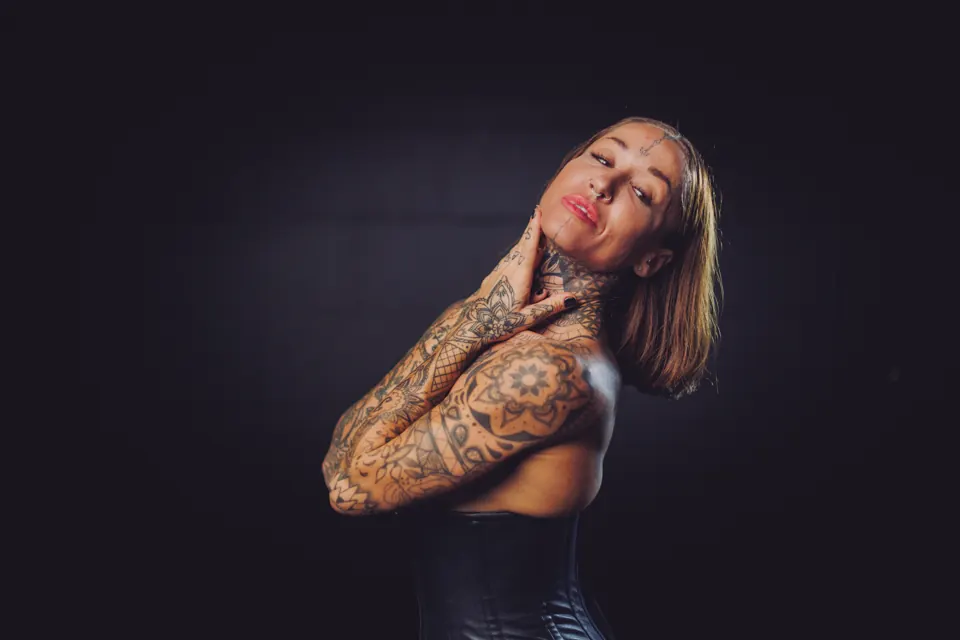 Tattooed woman in a sculptural side-profile portrait